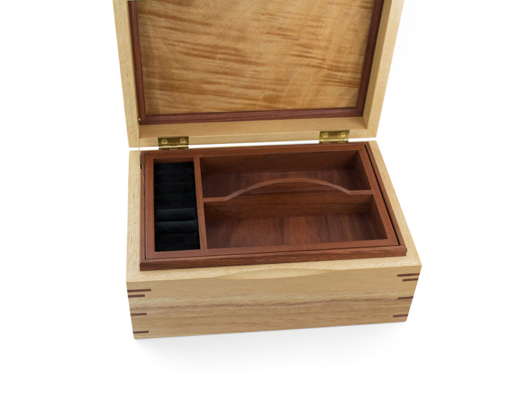 Top tray of jewellery box with velvet-lined ring compartment